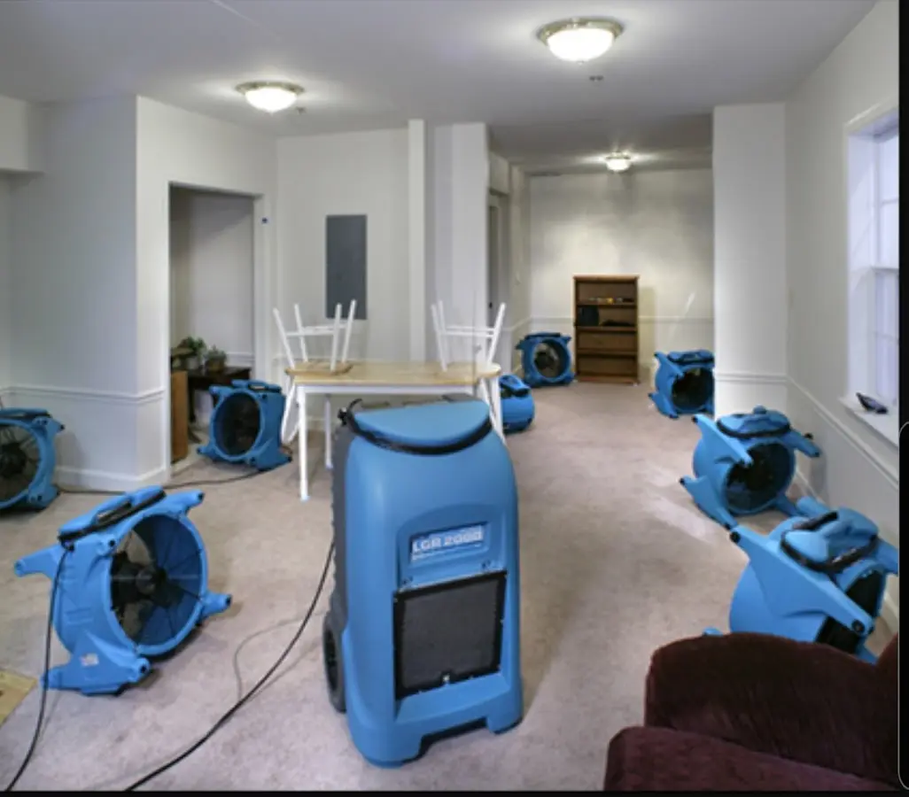 Air movers and dehumidifier setup for Water Damage Restoration in Williston